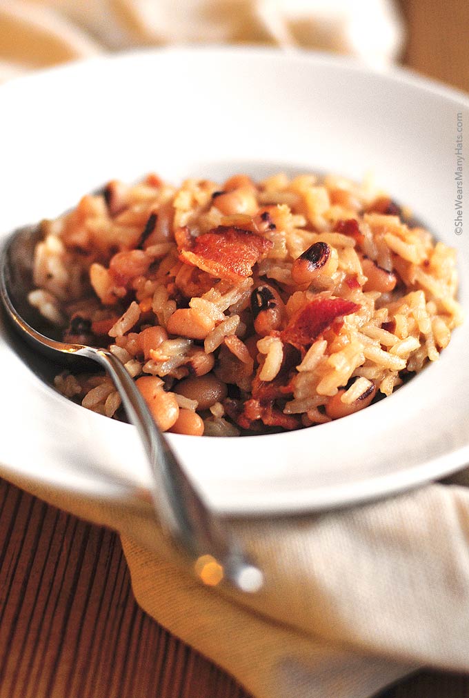 Hoppin John is a traditional southern New Year's Day dish made of black-eyed peas and rice, accented with pork. | shewearsmanyhats.com
