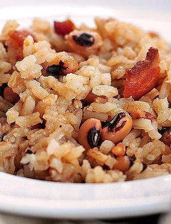 Hoppin John is a traditional southern New Year's Day dish made of black-eyed peas and rice, accented with pork.