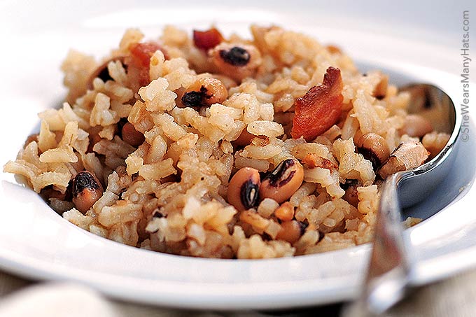Hoppin John is a traditional southern New Year's Day dish made of black-eyed peas and rice, accented with pork. | shewearsmanyhats.com