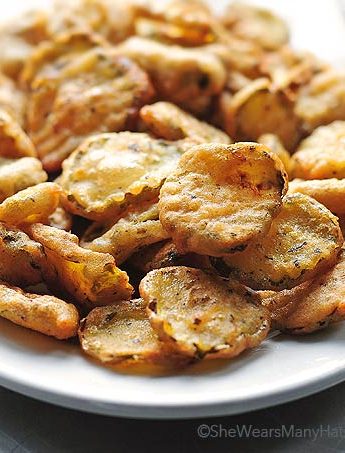 golden brown fried pickles on a plate