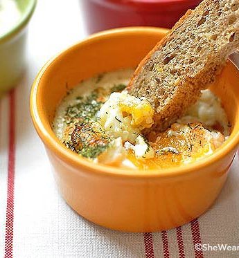 Baked Eggs In A Bowl With Slice Of Bread On Top