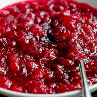 Homemade Cranberry Sauce Recipe in a bowl with spoon inside