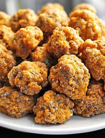 These Sausage Balls are the perfect savory bite for serving at parties. This recipe is easy and made without baking mix.