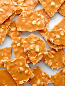 This Peanut Brittle Recipe is a favorite treat made with simple ingredients and cooks in about 15 minutes. It's the perfect edible gift during the holidays.