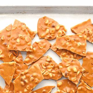 This Peanut Brittle Recipe is a favorite treat made with simple ingredients and cooks in about 15 minutes. It's the perfect edible gift during the holidays.