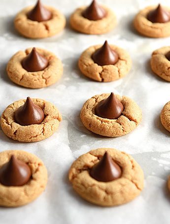 Peanut Butter Blossoms combine a simple peanut butter cookie with a chocolate kiss plopped right in the middle for an especially delicious sweet bite.