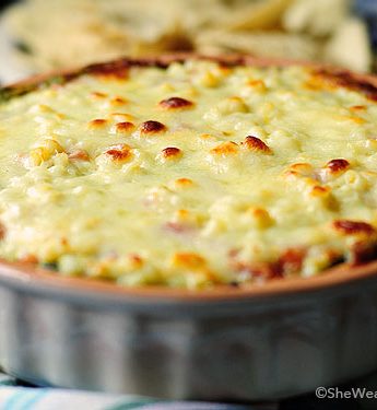 This Warm Layered Black Bean Dip with cilantro pesto and Monterey Jack cheese is a delicious addition to any gathering.