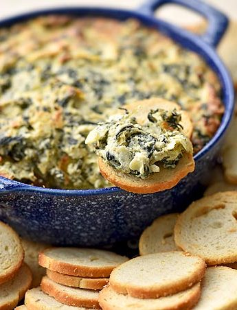 Make a batch of this Spinach Artichoke Dip for your next get together and watch the smiling faces crowd around with a chip in hand.
