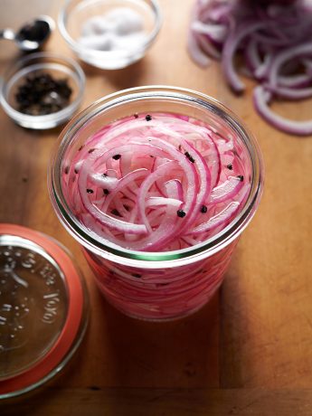 jar of sliced red onions in vinegar to make pickled red onions