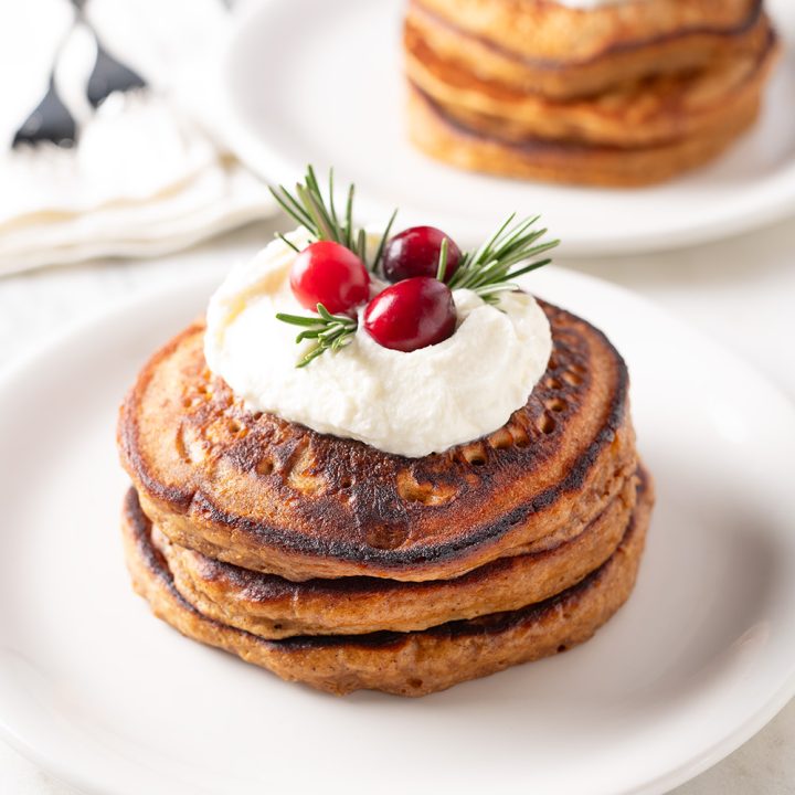 Stacks of homemade Gingerbread Pancakes. Recipe from shewearsmanyhats.com